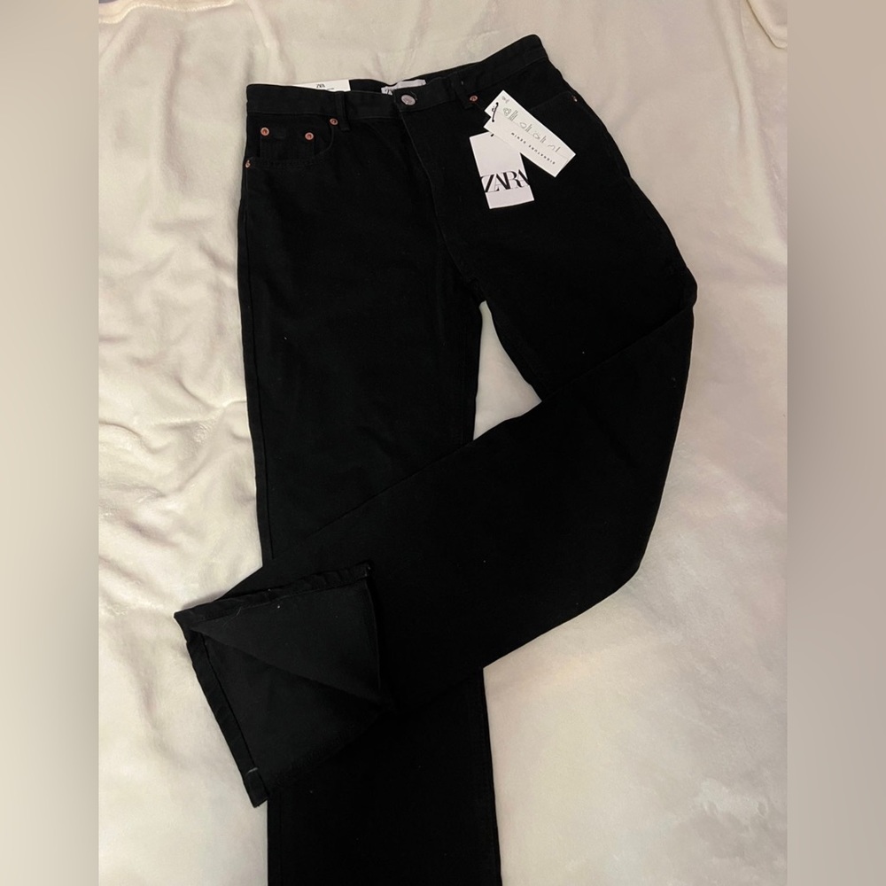 Black Zara 90s slim jeans with split hem.